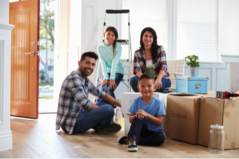 family moving with boxes