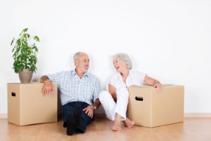 Happy Senior Couple with Boxes
