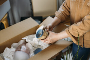 Woman Packing Dishes