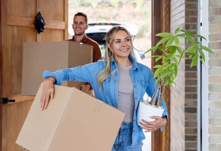 Homeowners Arriving at Their New Home With Boxes